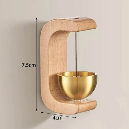 Bamboo doorbell chime on wooden door for gentle arrival alert